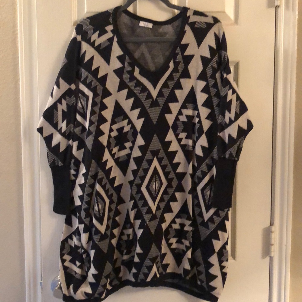 Poncho sweater with fitted sleeves